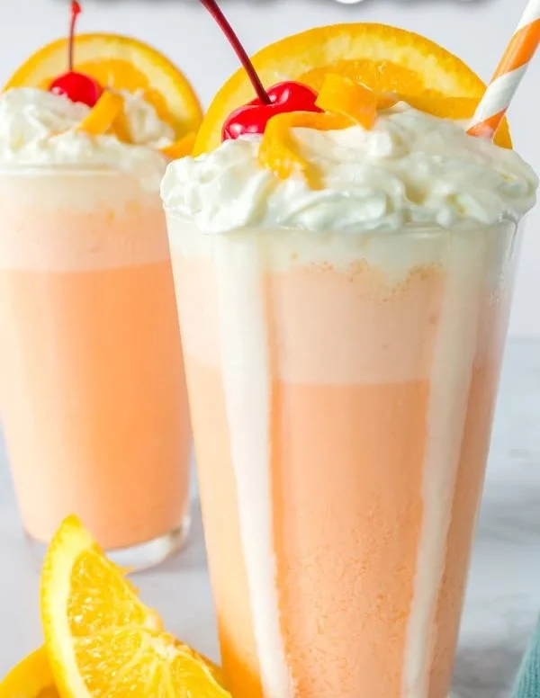 Delicious orange creamsicle milkshake topped with whipped cream