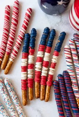 Patriotic pretzel rods decorated with red, white, and blue sprinkles