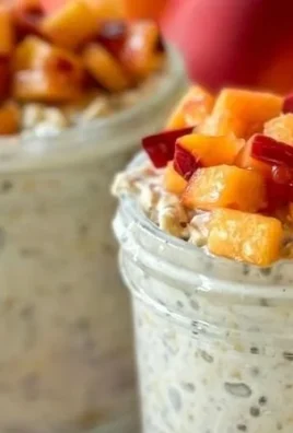 Peach Cobbler Overnight Oats topped with fresh peaches and crumbly topping