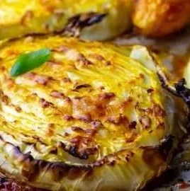 Roasted cabbage steaks topped with Parmesan cheese, a healthy veggie dish.