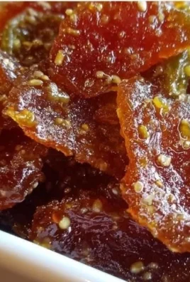 Jar of sweet and spicy cowboy candy with jalapeños and sugar