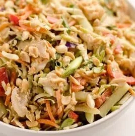 Thai Peanut Chicken Crunch Slaw Salad with fresh vegetables and peanut sauce