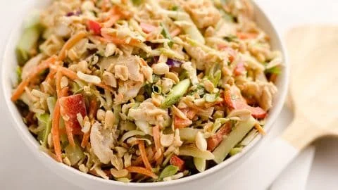 Thai Peanut Chicken Crunch Slaw Salad with fresh vegetables and peanut sauce