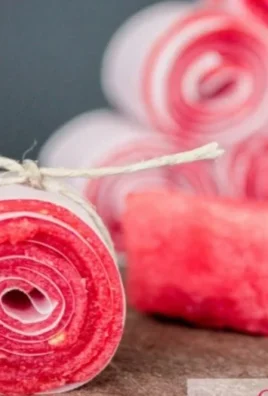 Homemade watermelon fruit leathers stacked attractively on a plate