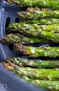 Delicious air-fried asparagus spears arranged on a plate.