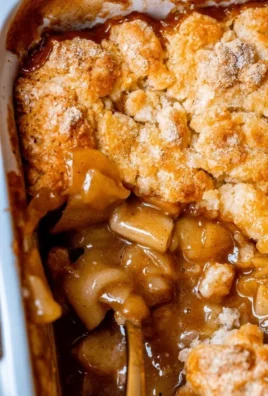 Delicious homemade apple cobbler served warm with a scoop of ice cream
