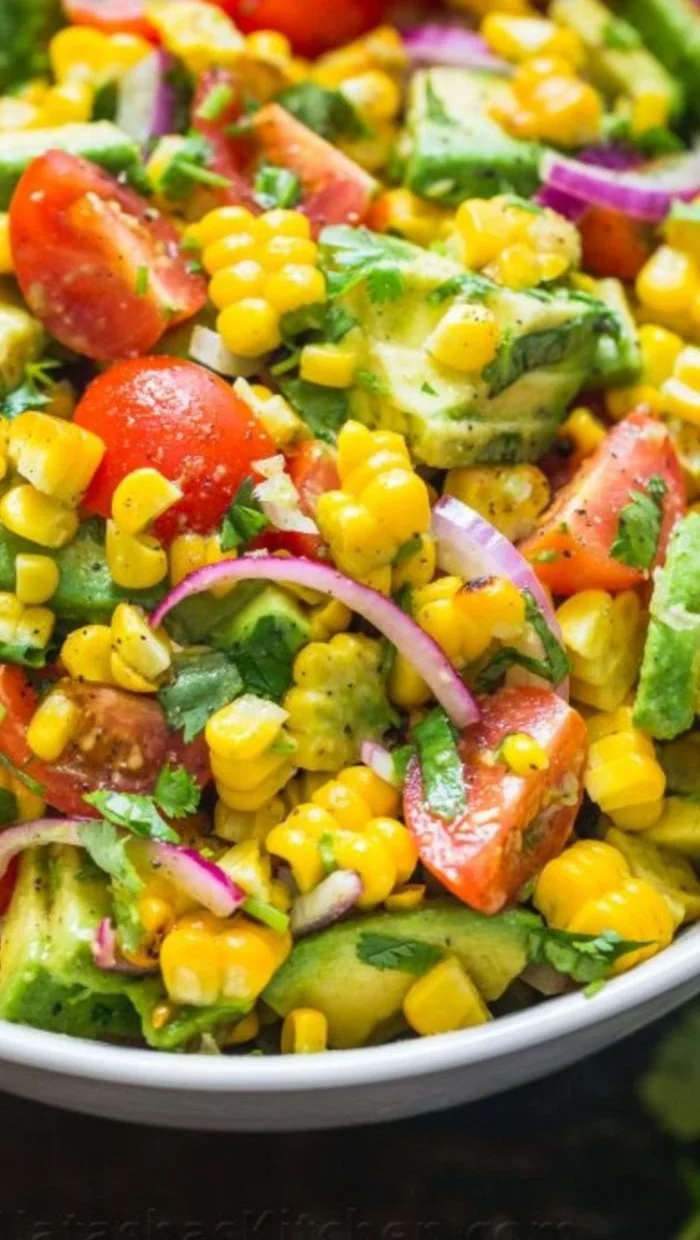 Delicious and colorful Avocado Corn Salad featuring fresh ingredients.