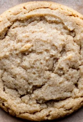 Batch of chewy peanut butter cookies on a cooling rack
