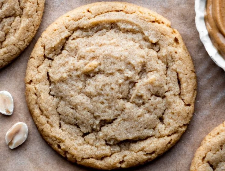 Batch of chewy peanut butter cookies on a cooling rack