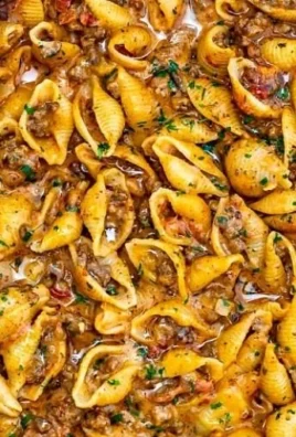 Creamy beef and shells pasta dish served in a bowl