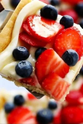 Delicious easy fruit pizza topped with fresh fruits and cream cheese icing