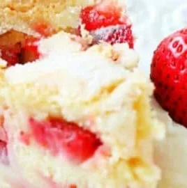 A beautifully decorated French Strawberry Cake topped with fresh strawberries