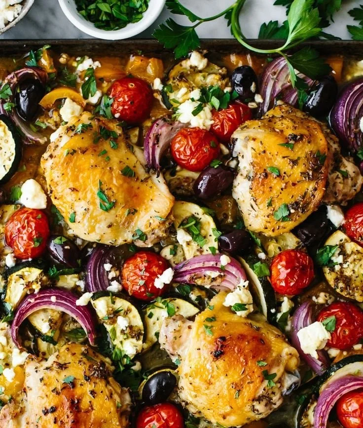 Greek Sheet Pan Chicken with vegetables on a baking sheet