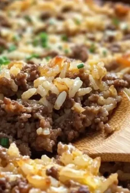 Delicious Hamburger Rice Casserole served in a baking dish with cheese toppings