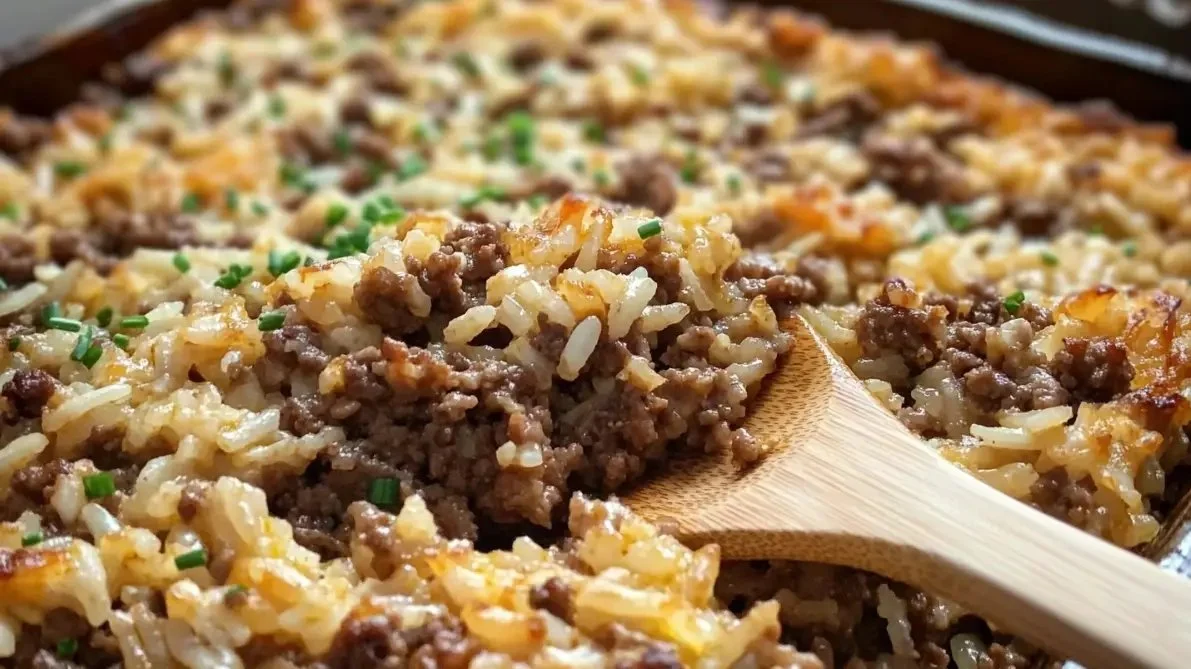 Delicious Hamburger Rice Casserole served in a baking dish with cheese toppings