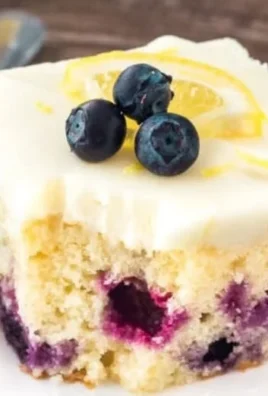 Lemon Blueberry Cake with fresh blueberries and lemon zest on top