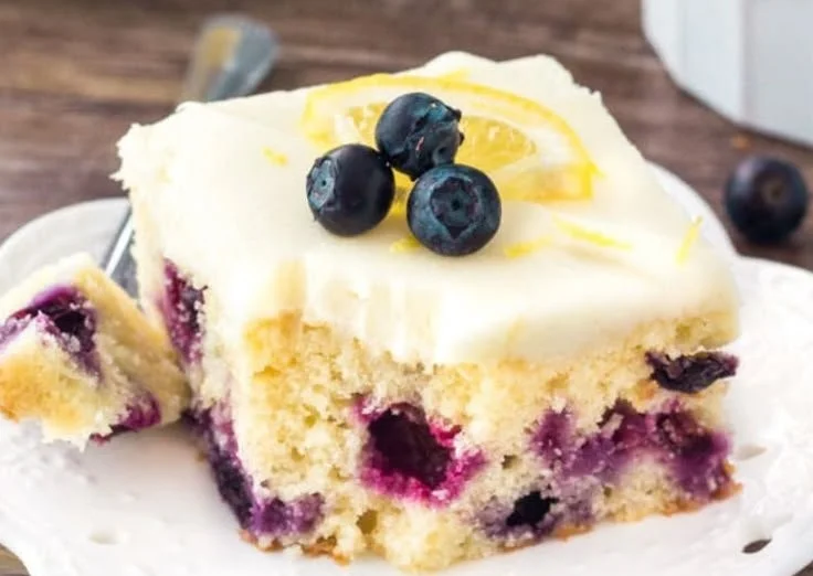 Lemon Blueberry Cake with fresh blueberries and lemon zest on top