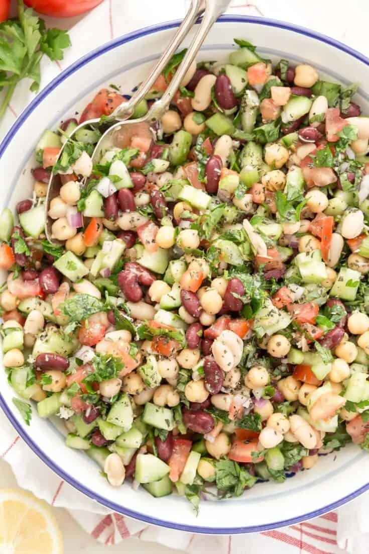 Colorful Mediterranean Bean Salad with fresh vegetables and herbs