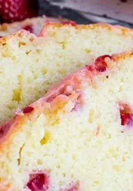 Delicious homemade Strawberry Pound Cake topped with fresh strawberries