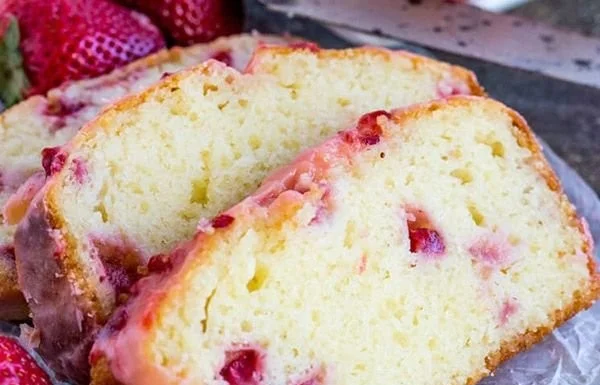 Delicious homemade Strawberry Pound Cake topped with fresh strawberries