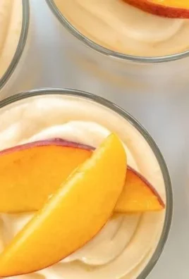 Delicious Summer Peach Mousse Trifles in elegant glass cups.