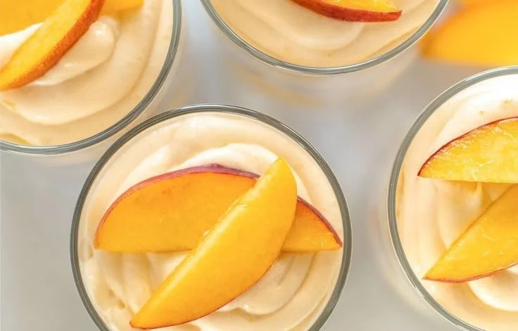 Delicious Summer Peach Mousse Trifles in elegant glass cups.